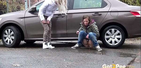  Blonde And Brunette Squat And Piss Together